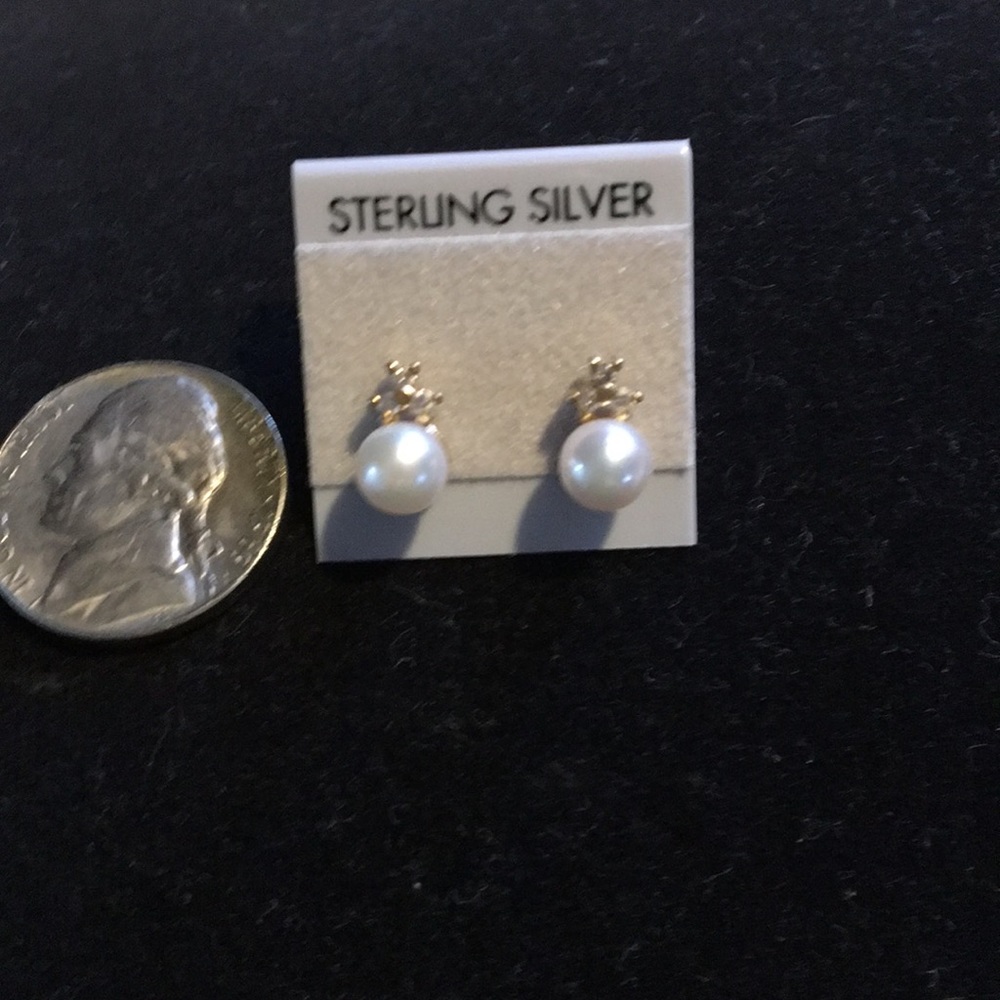Vintage pearl and diamond pierced earrings.